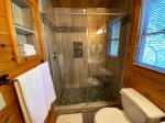 Loft Master Bathroom with a Walk-In Tile Shower 